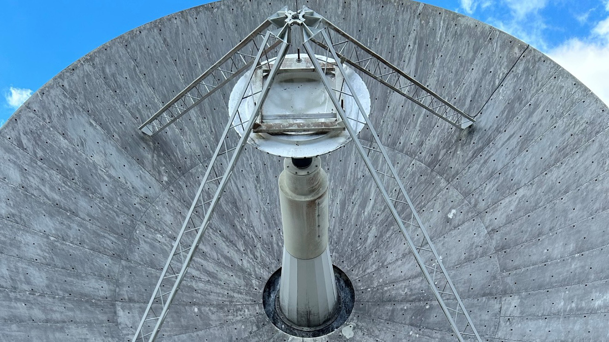 A close-up photo of a large satellite, which extends out of the frame of the photo.