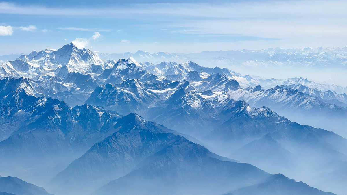 The summit of Mount Everest soars above other peaks of the Himalayas.
