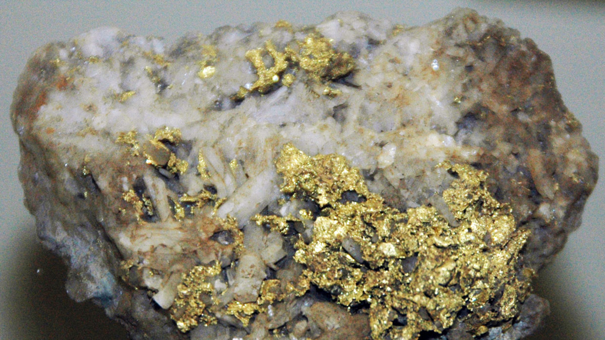Gold specks on quartz