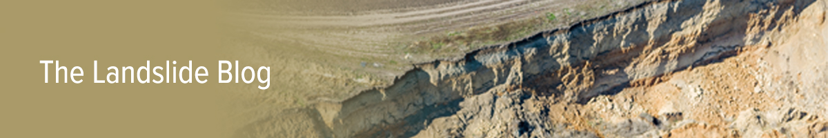 At left, the words “The Landslide Blog” appear in white over a tan background that gradually becomes transparent to the right, revealing a sheer cliff face with rubble below it.